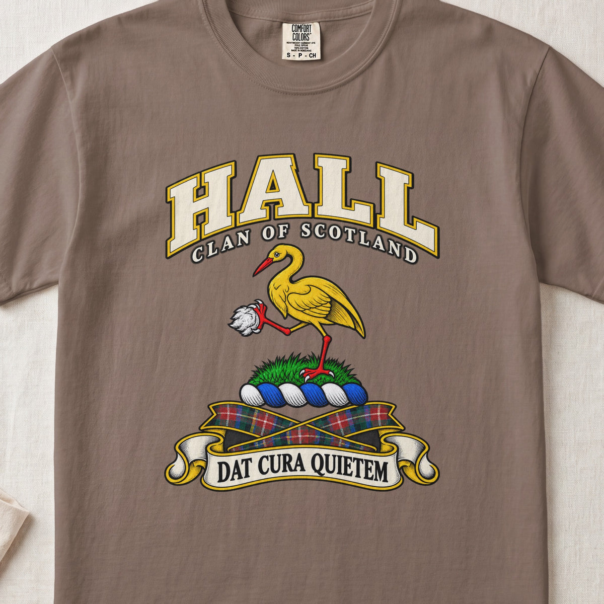 Hall Scottish clan T-shirt in Espresso, front view with a golden crane holding a white stone and motto banner.