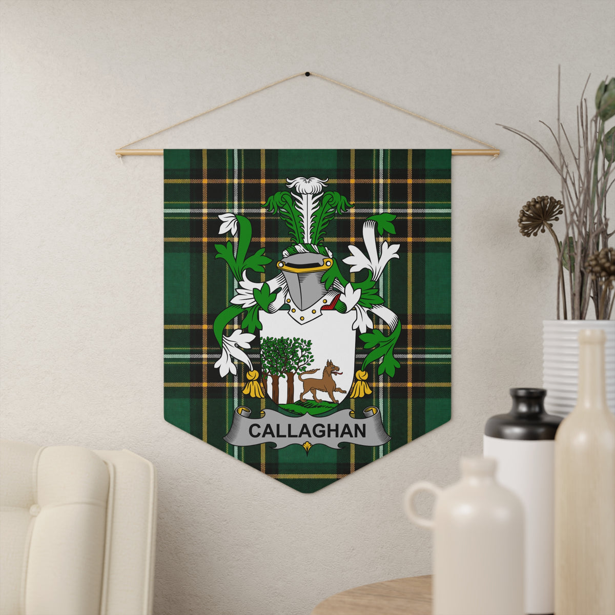 Callaghan coat of arms banner with tartan background hanging on wall.