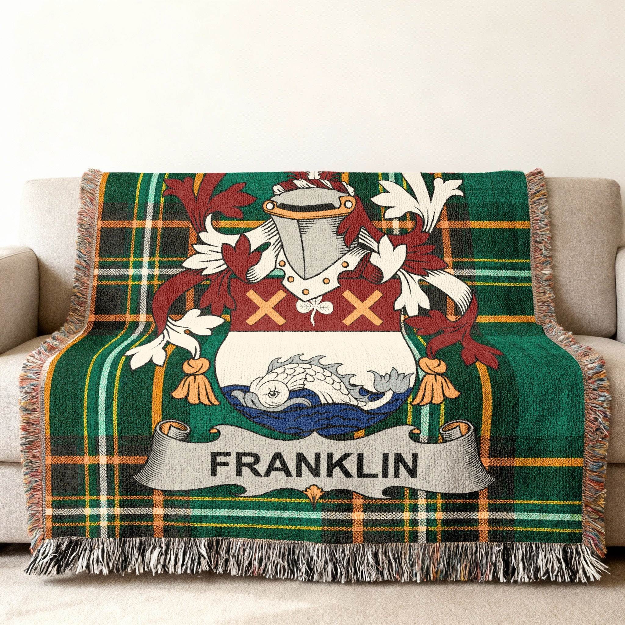 Franklin family crest on green plaid woven throw blanket with fringe.