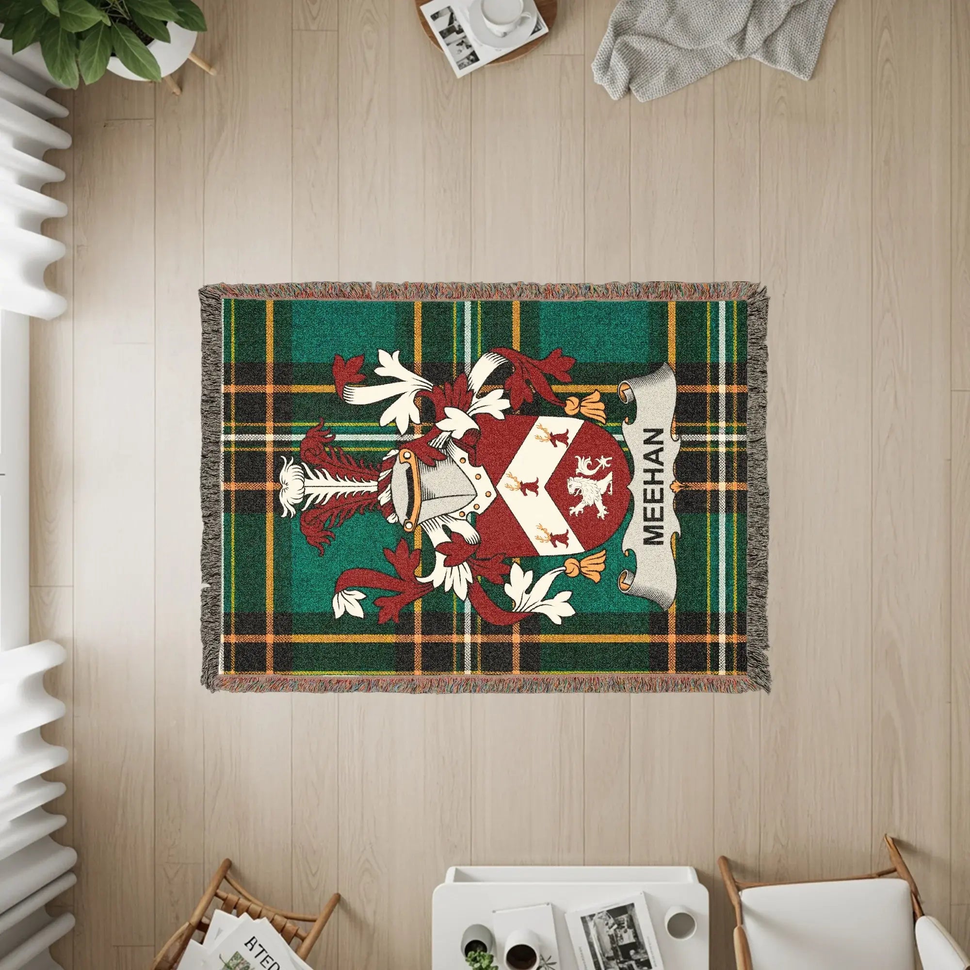 Green plaid woven throw blanket with MEHAN family crest.