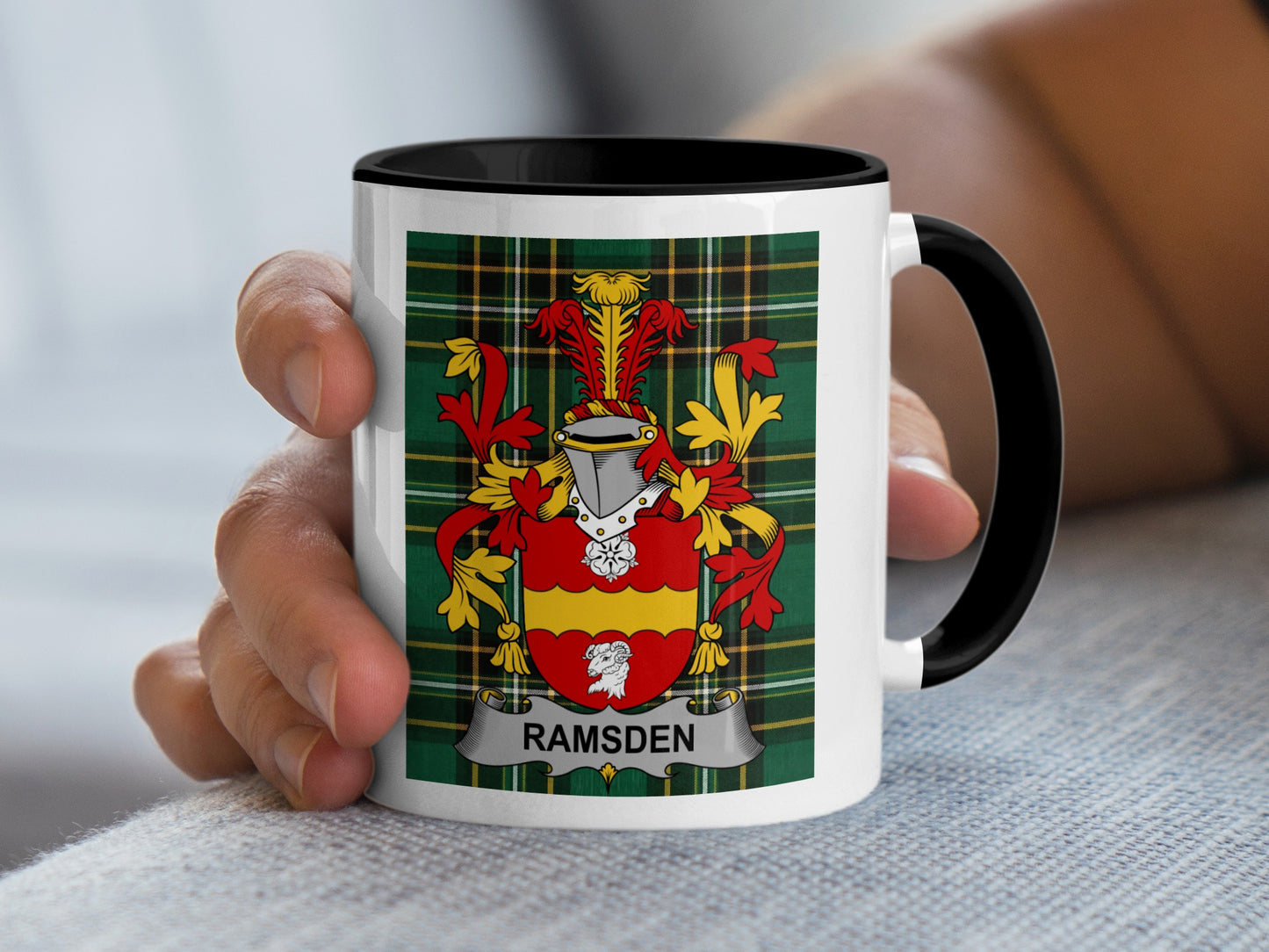 White mug with black rim features a tartan pattern and Ramsden family crest.