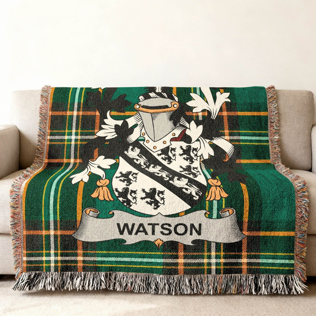 Watson family crest on a green plaid woven throw blanket.