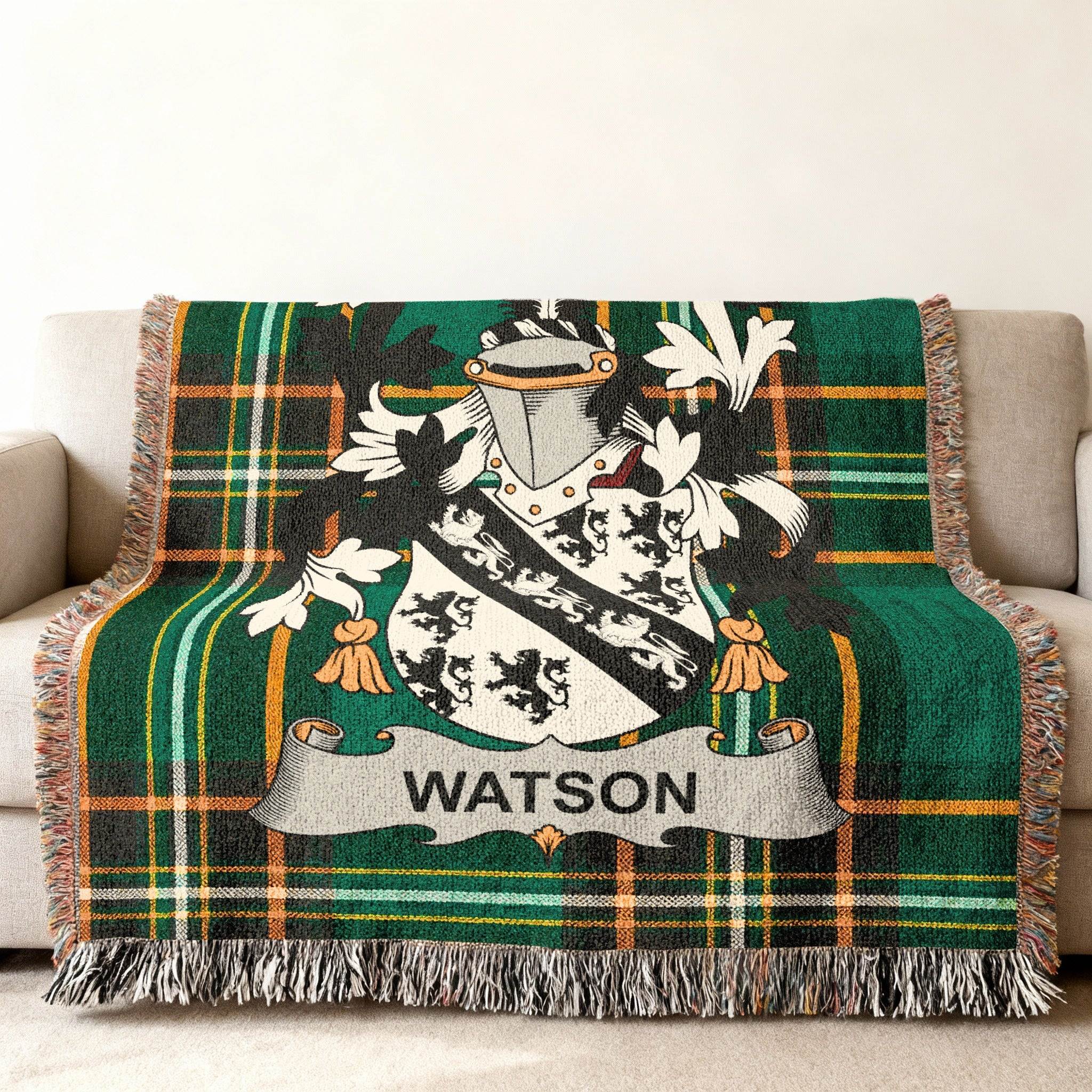 Watson family crest on a green plaid woven throw blanket.