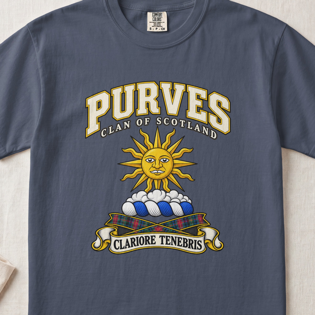 Purves Scottish clan T-shirt in Midnight, front view with a golden sun above clouds and motto design.