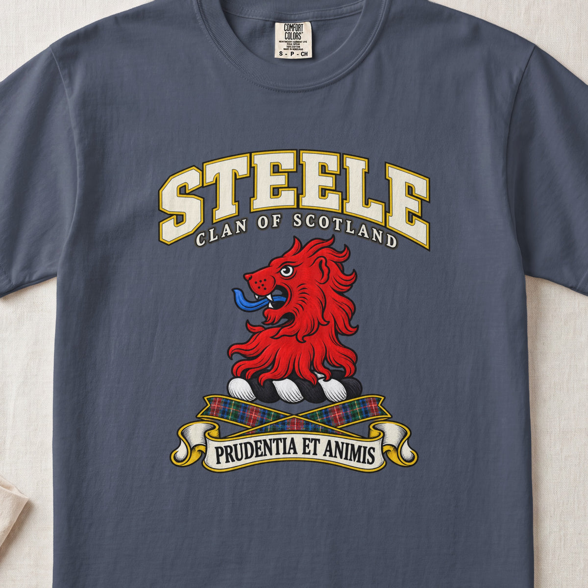 Steele Scottish clan T-shirt in Midnight, front view with a red lion head and motto design.