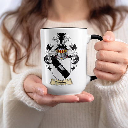 White mug with black rim featuring the Binning family crest.