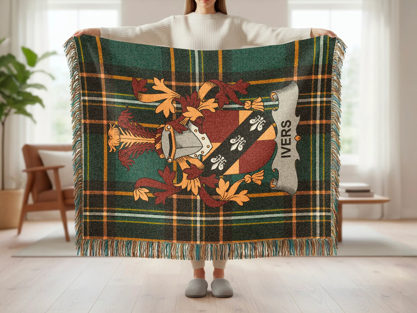 Tartan throw blanket with Ivers family crest and fringe detail.