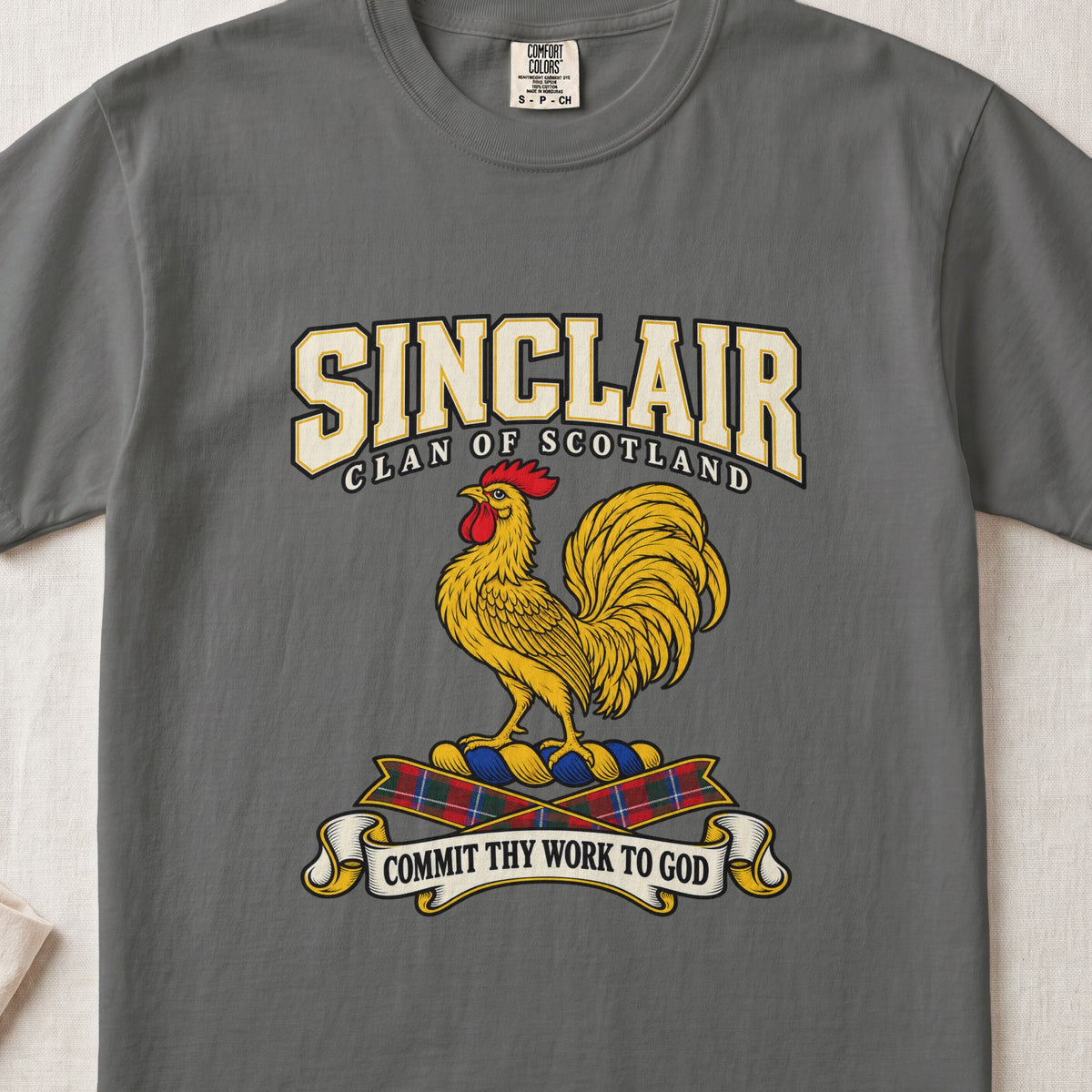Sinclair graphic T-shirt in Pepper gray, front flat lay showing varsity lettering and gold rooster with red comb and wattle.