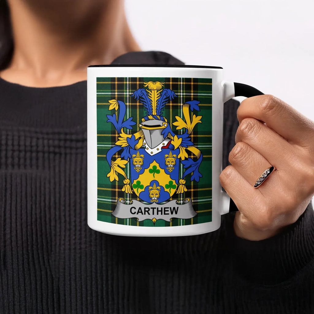 Mug with a blue and gold crest on a green tartan background, text reads "CARTHEW".