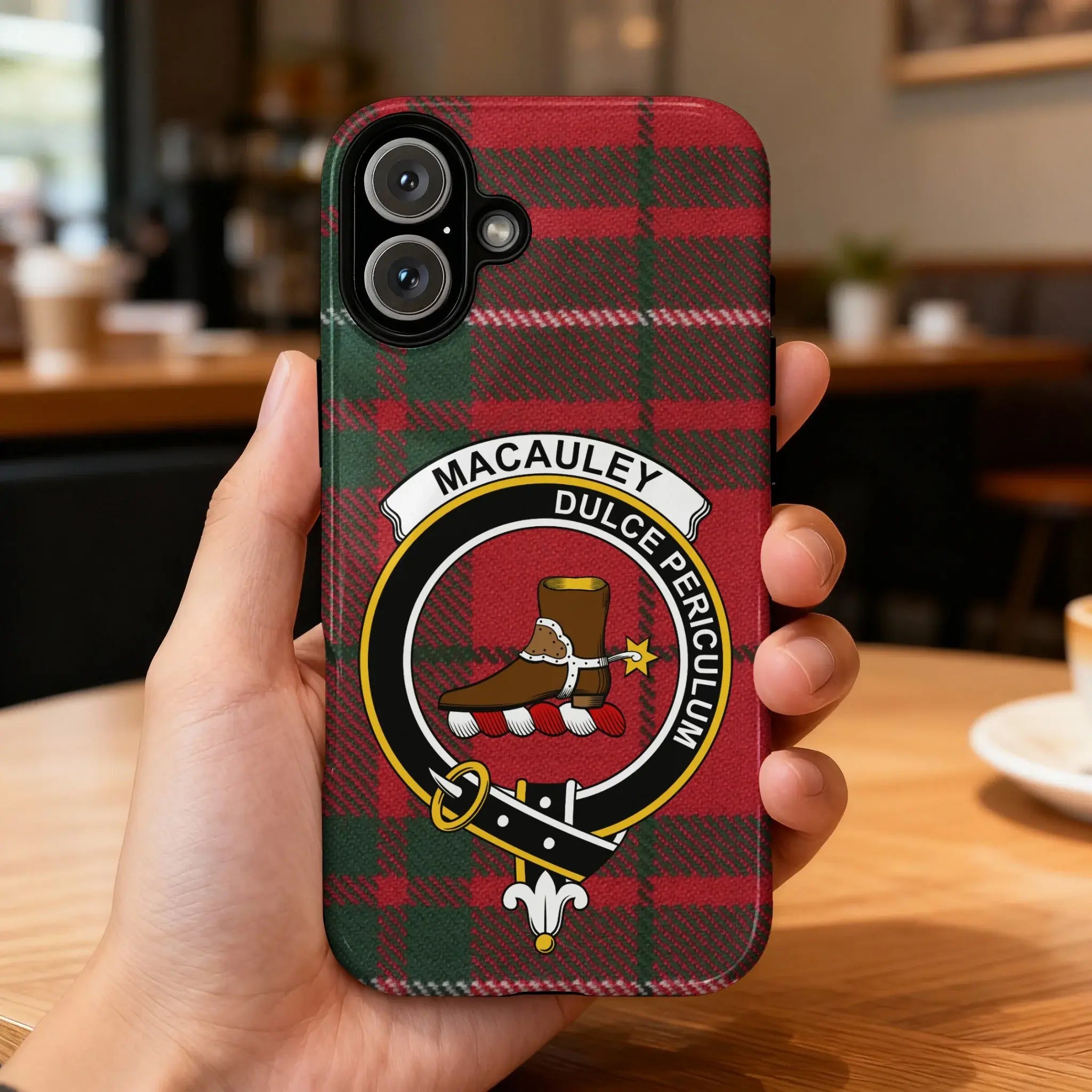 Clan MacAulay crest phone case — iPhone fit shown, edge-to-edge tartan print with port cutouts