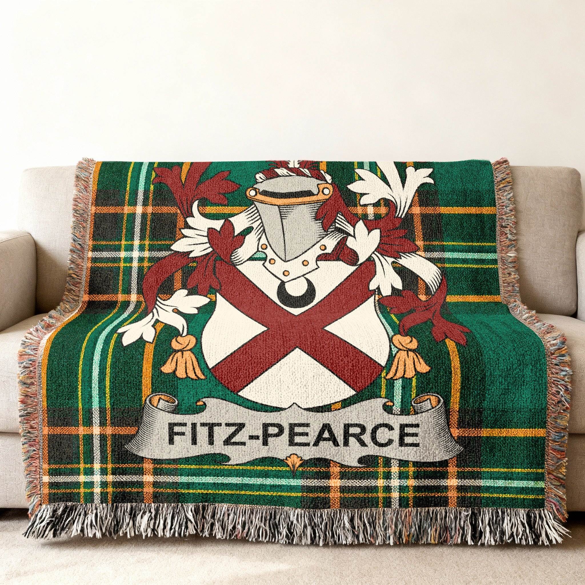 Fitz-Pearce family crest on a green plaid woven blanket draped on a sofa.