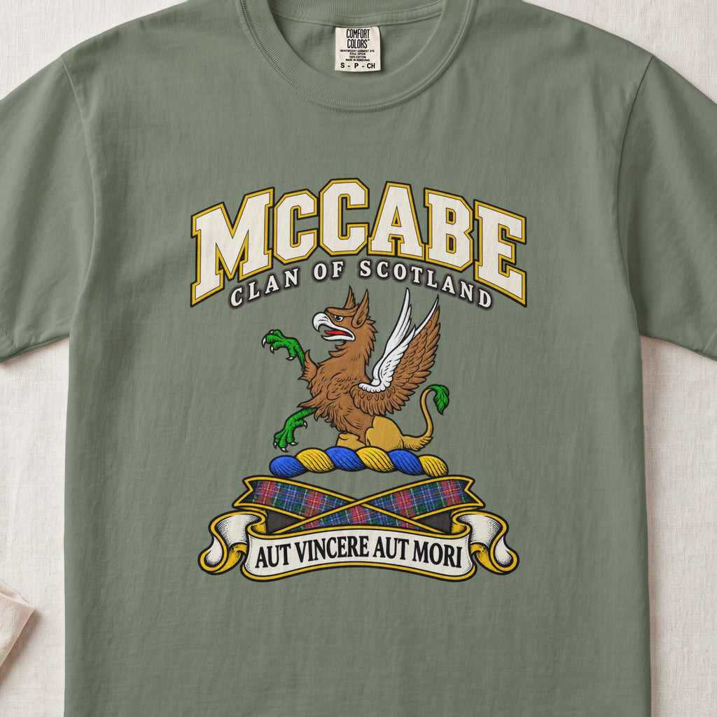 McCabe Scottish clan T-shirt in Moss, front view with a brown and gold winged griffin with green claws and motto banner.