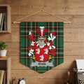 Ryan family crest on green plaid banner with heraldic shield and helmet.