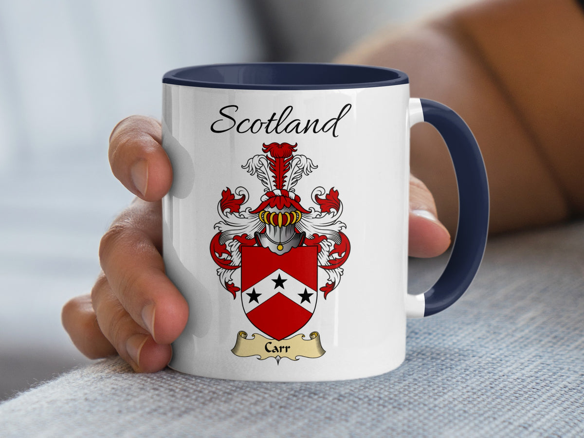 White Carr heritage mug with navy handle and interior, displaying “Scotland” and the colourful family emblem.