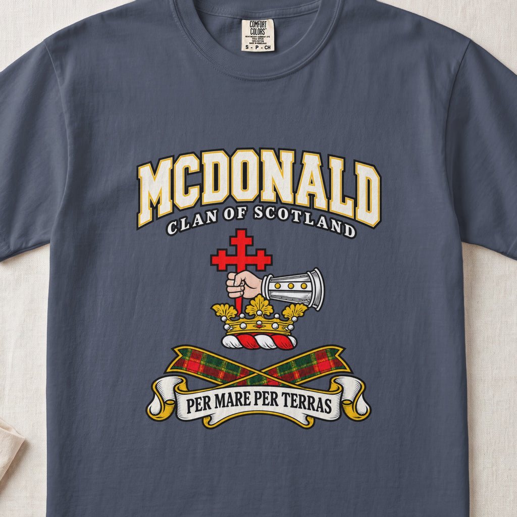 McDonald graphic T-shirt in Midnight blue, front flat lay showing varsity lettering and armoured forearm with hand holding red cross.