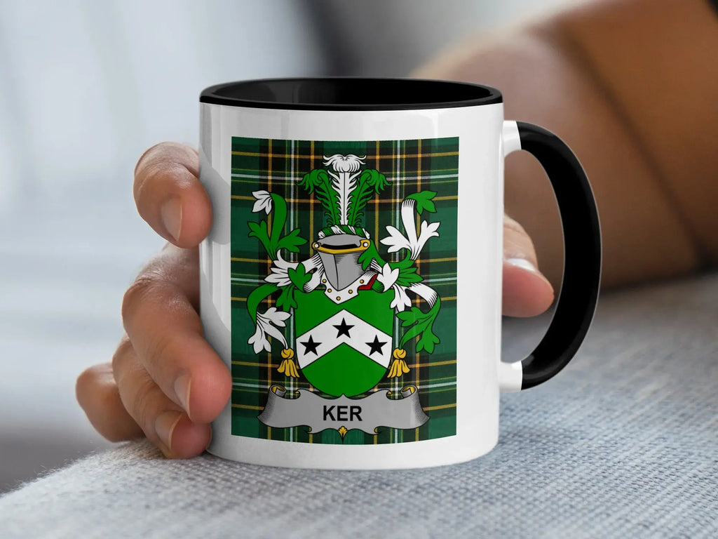 White mug with black rim featuring the Ker family crest on a plaid background.