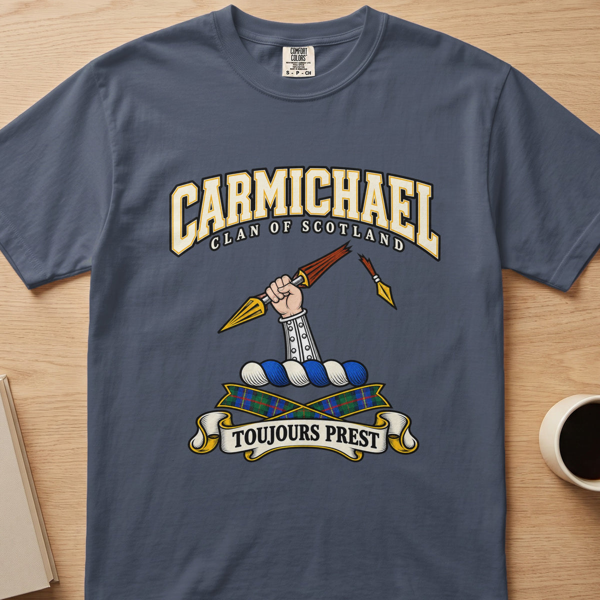 Carmichael clan crest with armored arm and broken spear on a slate blue Comfort Colors T-shirt, front view