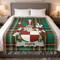 Tartan blanket with Tuite family crest.