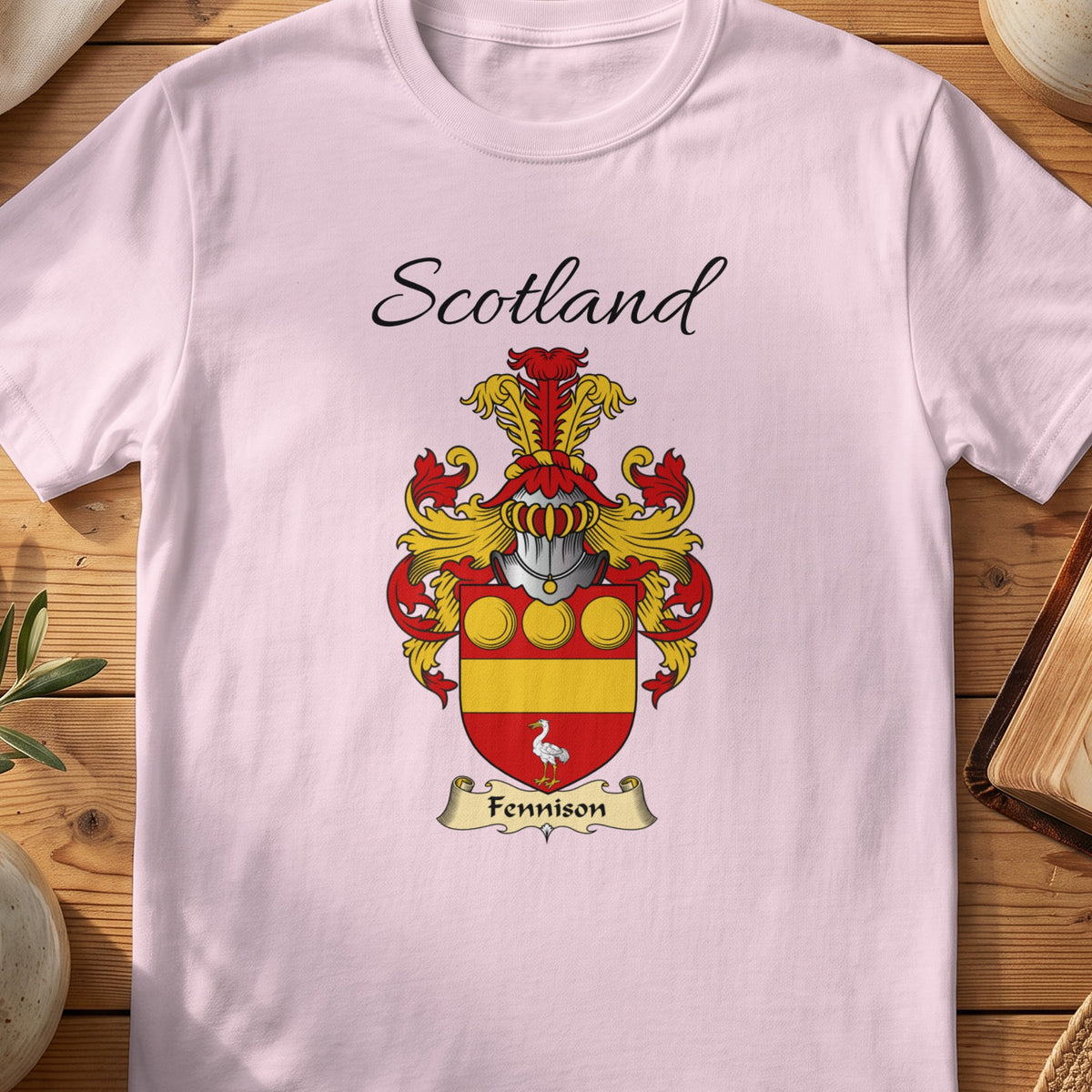Light Pink Fennison Scottish family shield T-shirt featuring gold roundels and a gold band on red