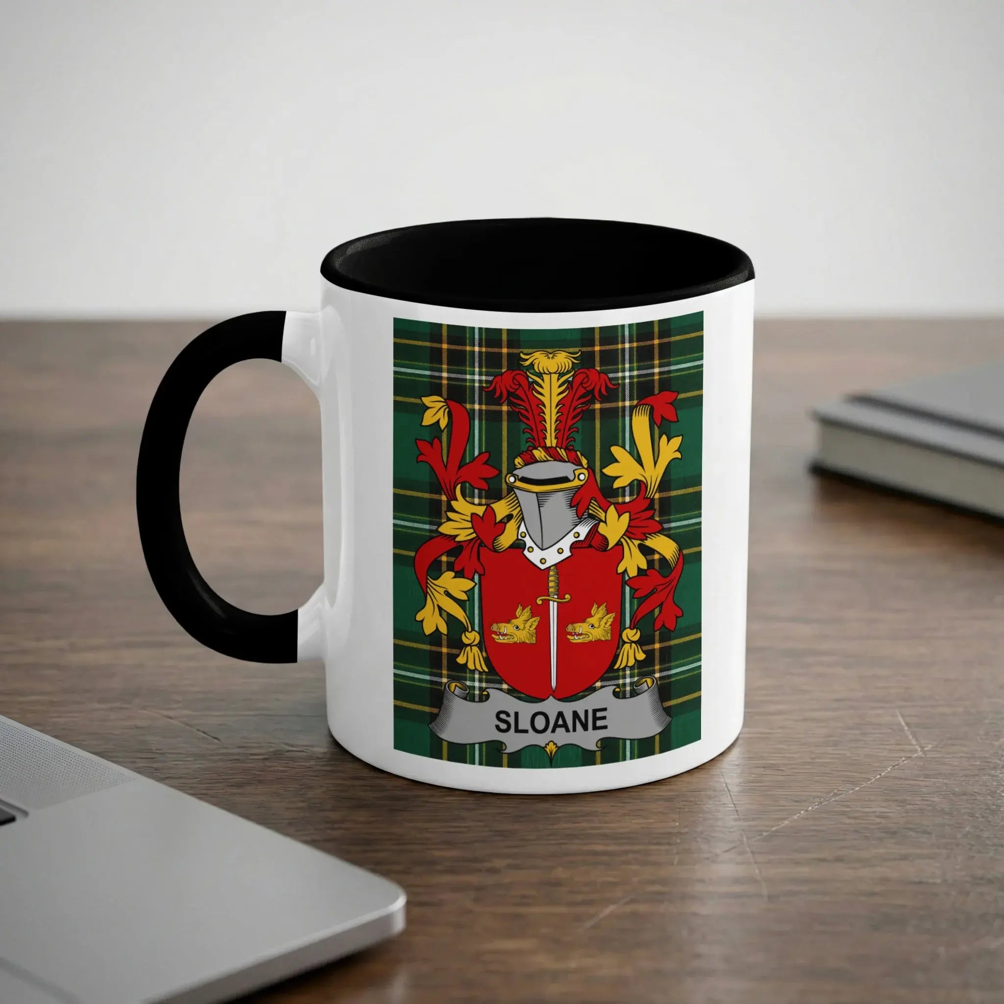 White mug with black handle displaying a family crest with the name SLOANE.
