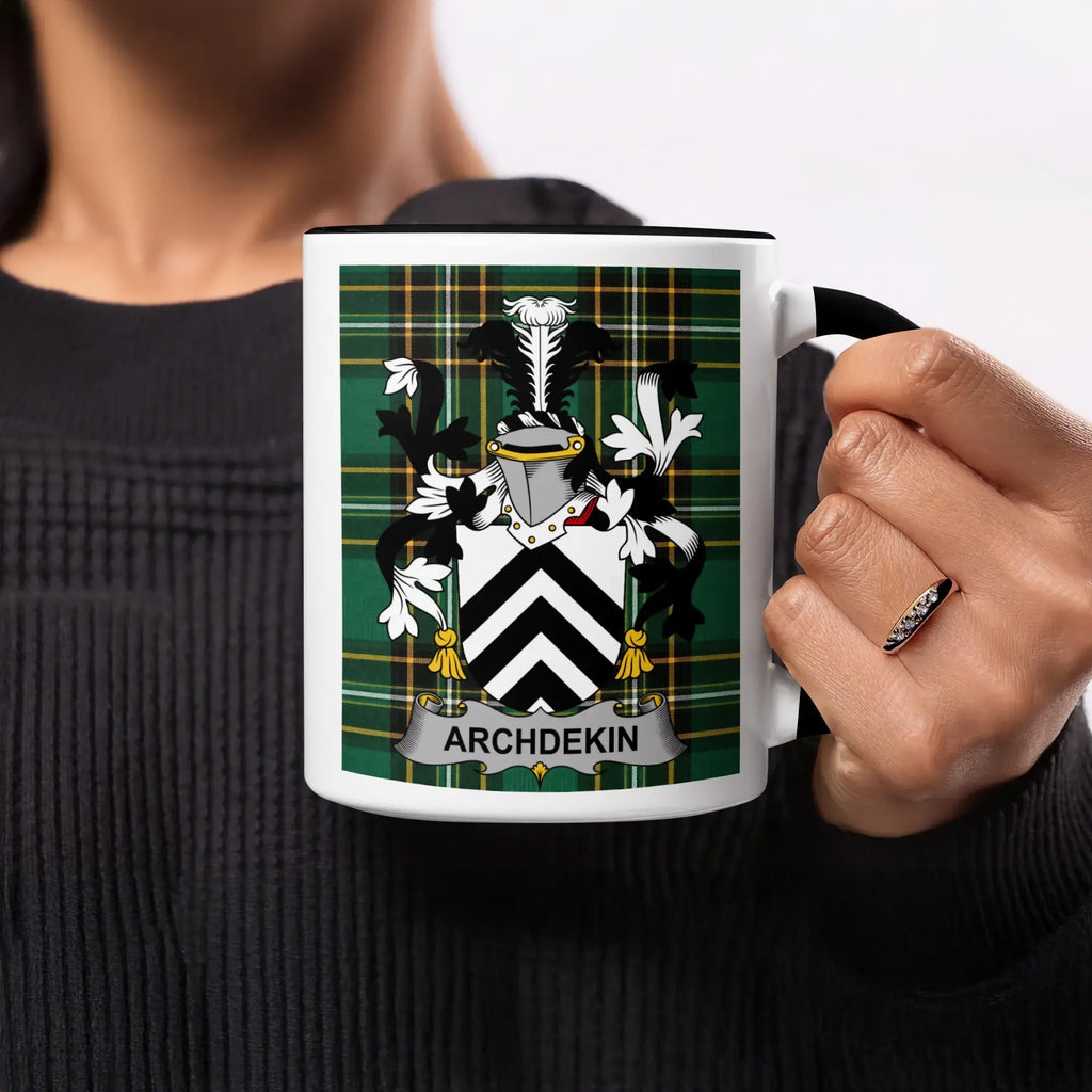 Mug with ARCHDEKIN family crest on plaid background.