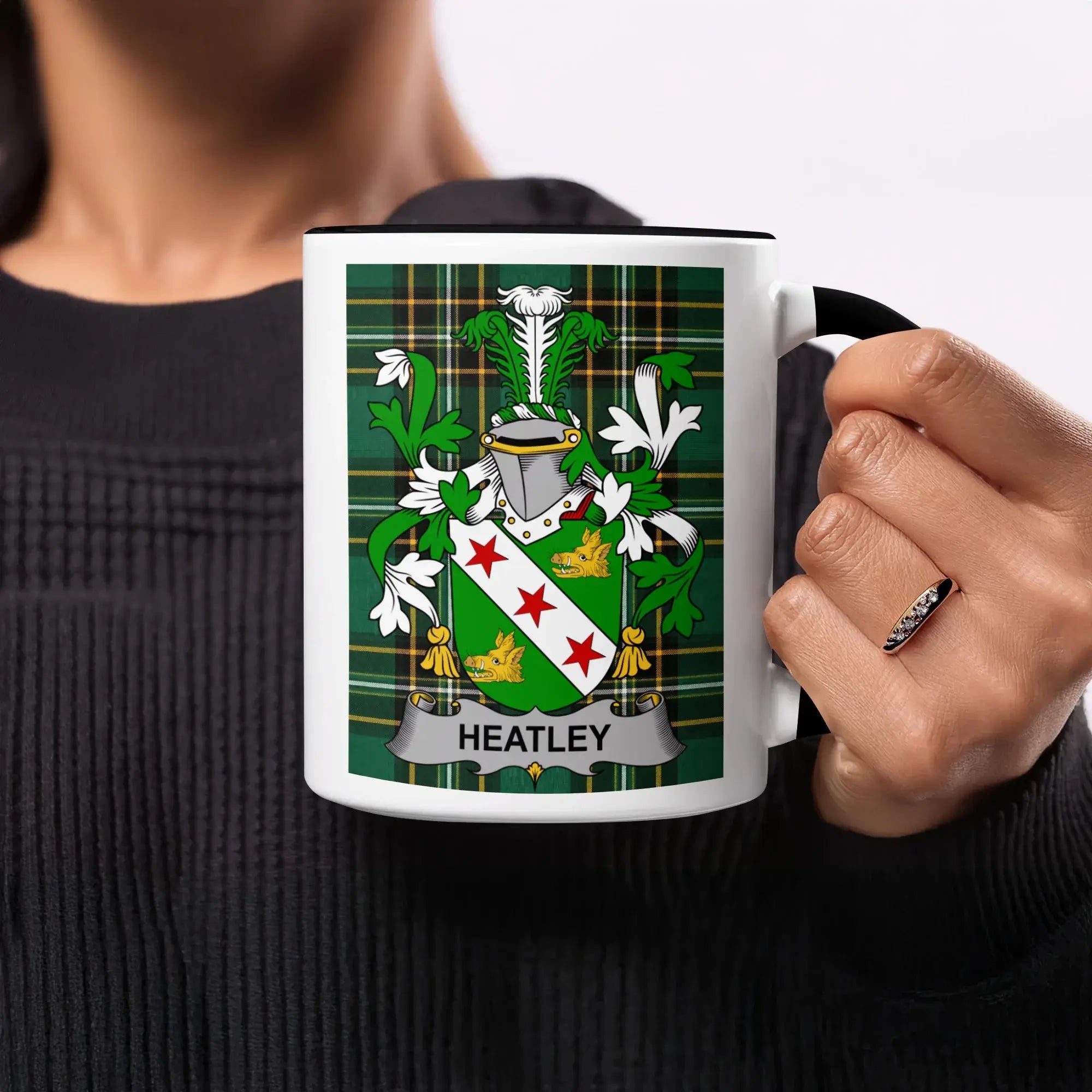 Mug with Heatley family crest on a green tartan background.
