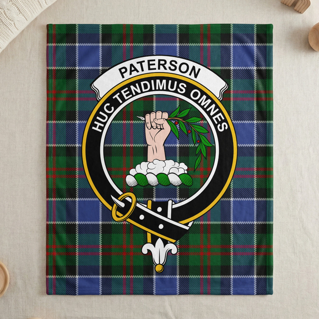 Paterson name banner and crest on tartan throw blanket — draped display