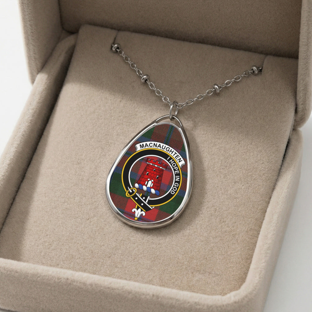 Macnaughton clan crest oval pendant necklace on tartan background in gift box