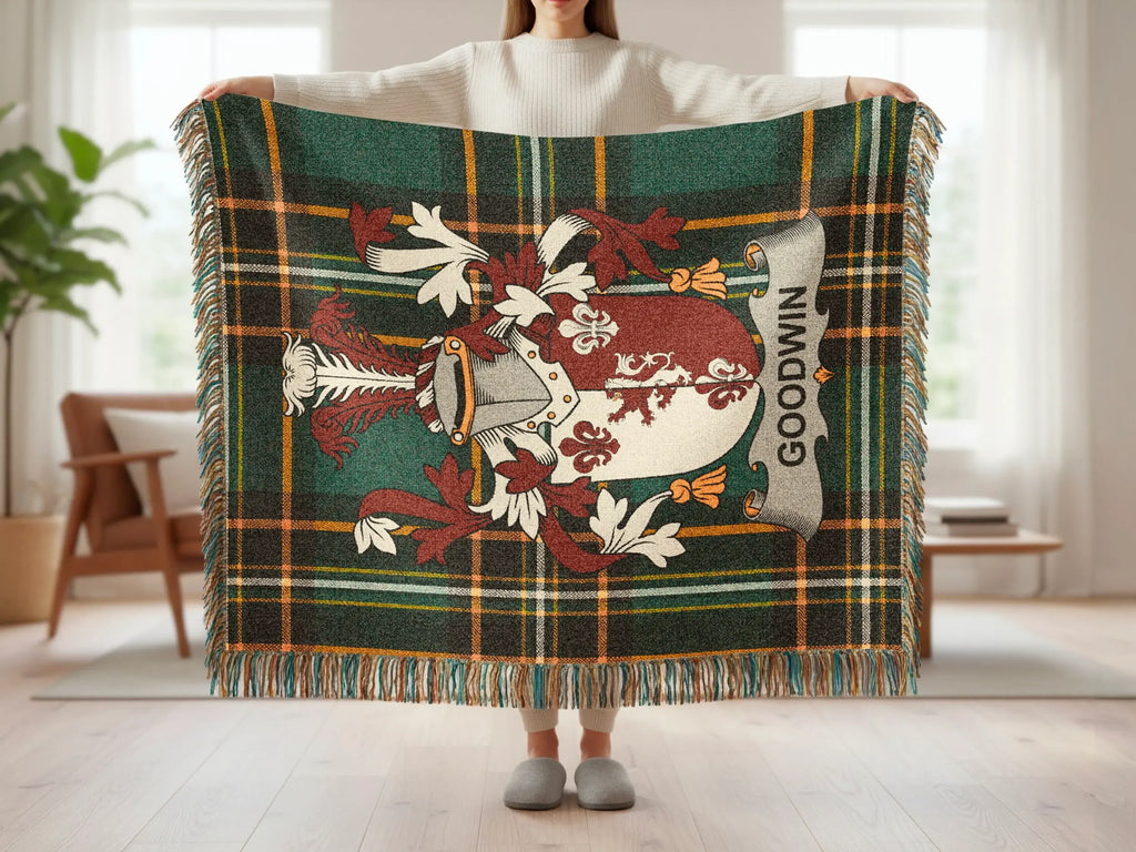 Goodwin family crest on a tartan plaid throw blanket.