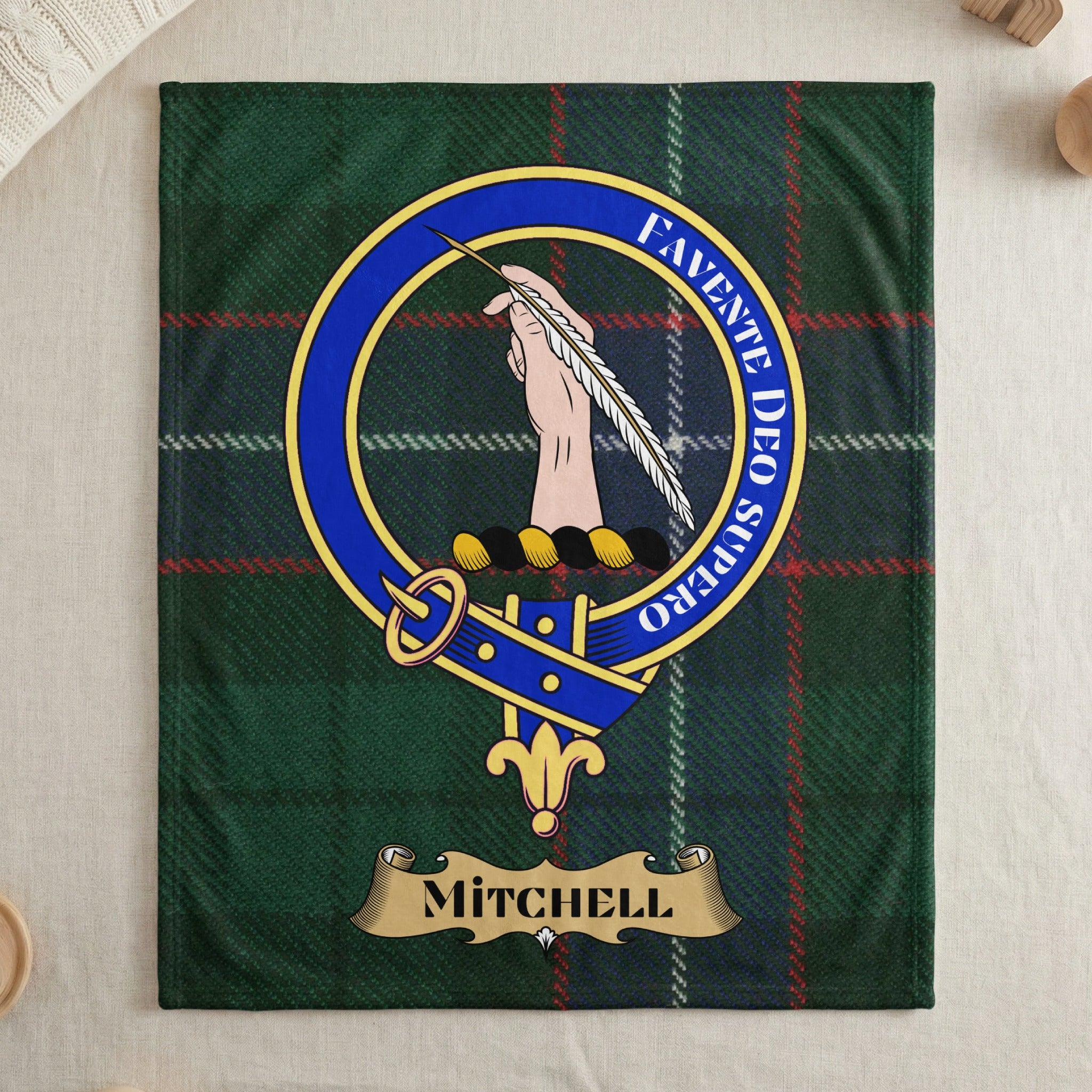 Mitchell name and crest on green tartan throw blanket — draped display