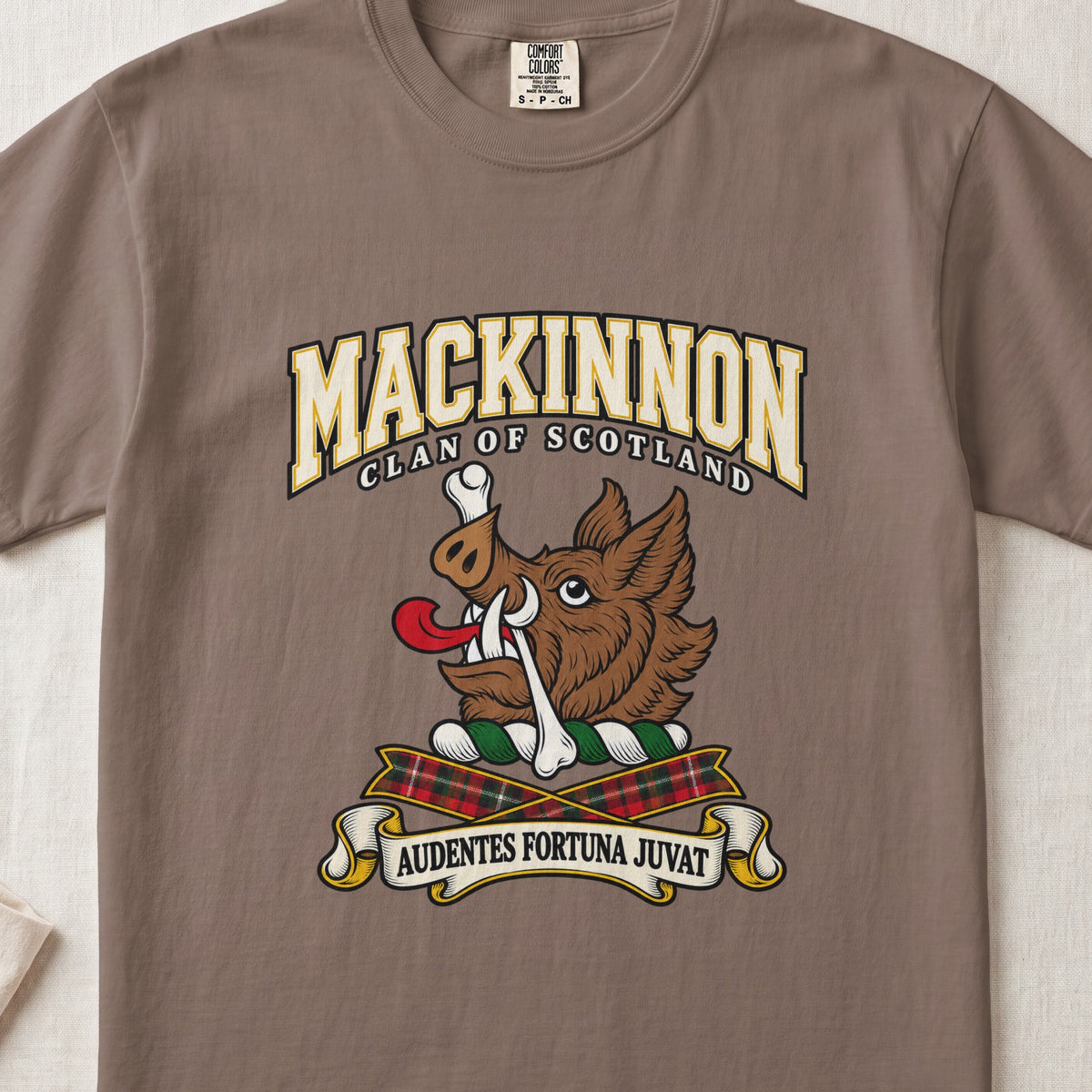 MacKinnon graphic T-shirt in Espresso brown, front flat lay showing varsity lettering and brown boar head with white tusks, red tongue and a white bone.