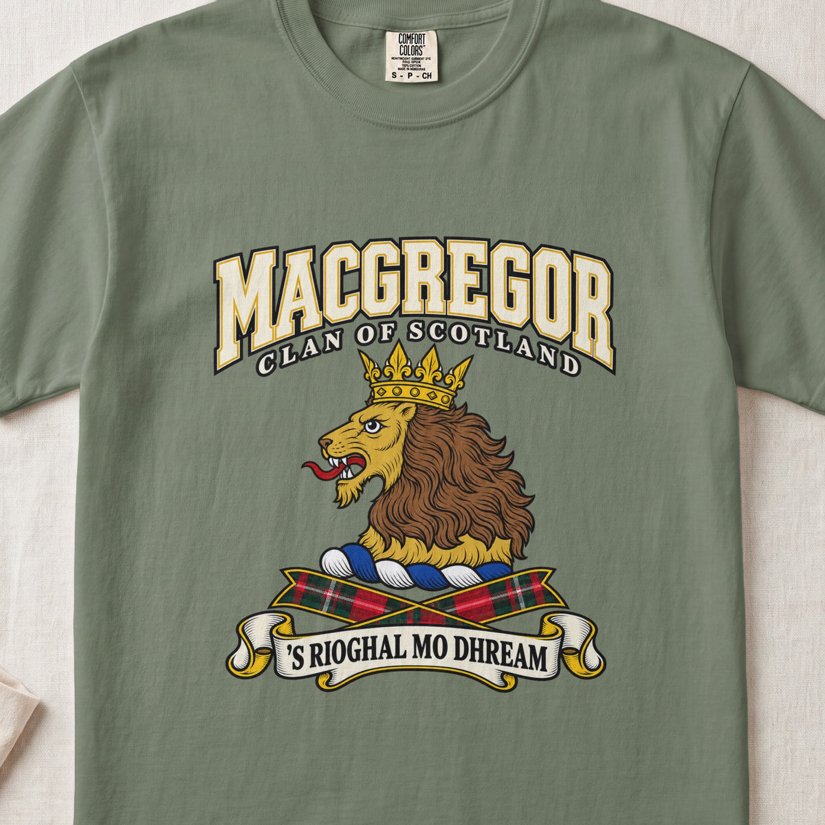 MacGregor graphic T-shirt in Moss green, front flat lay showing varsity lettering and gold lion head with brown mane and gold crown.