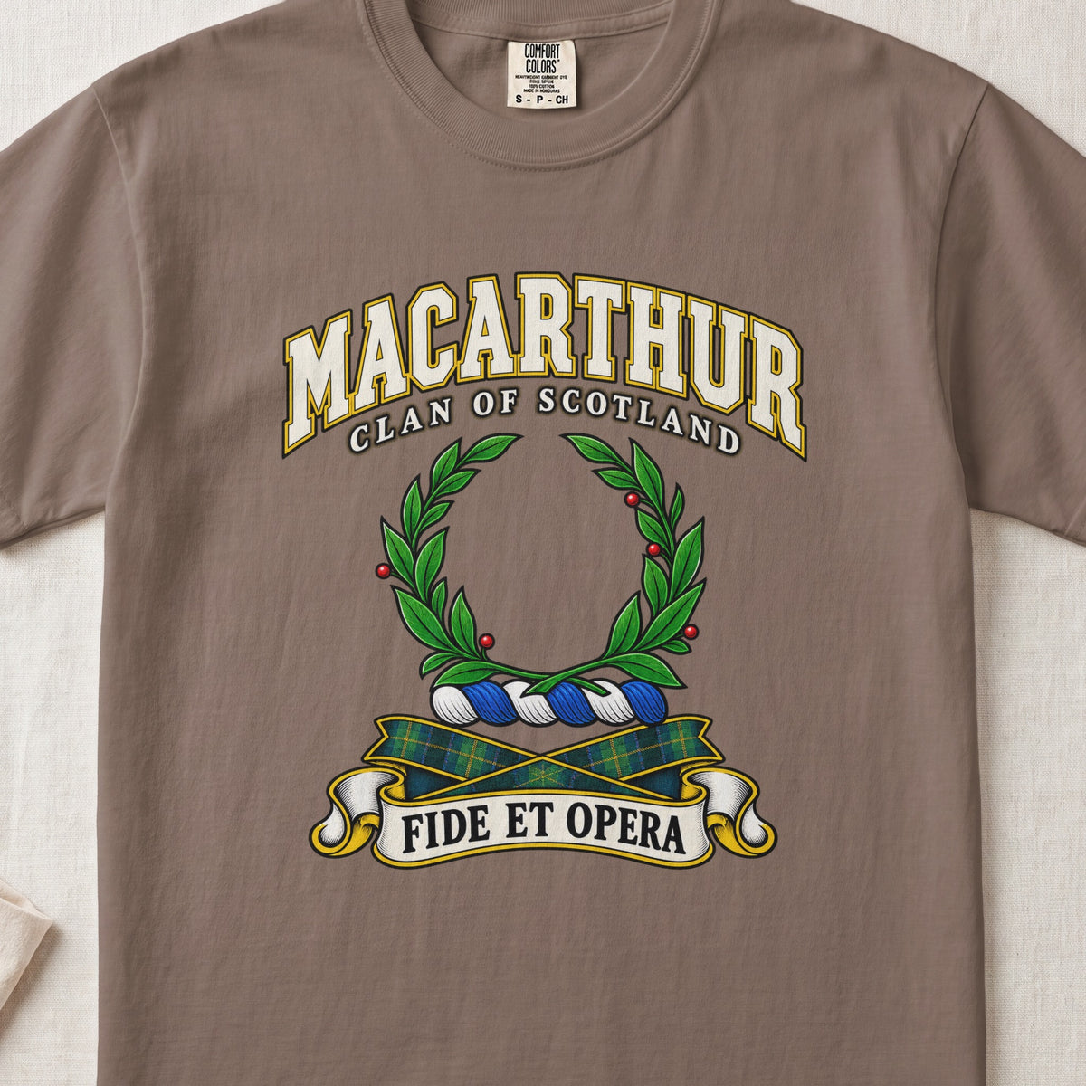 MacArthur Scottish clan T-shirt in Espresso, front view with a green laurel wreath and motto design.
