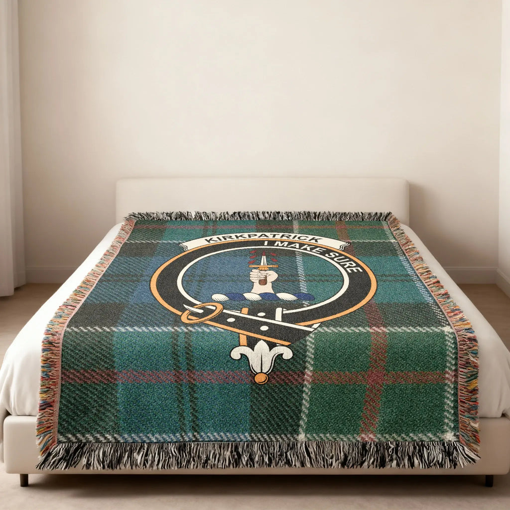 Clan Kirkpatrick tartan woven blanket — folded view showing fringe detail and I Make Sure crest