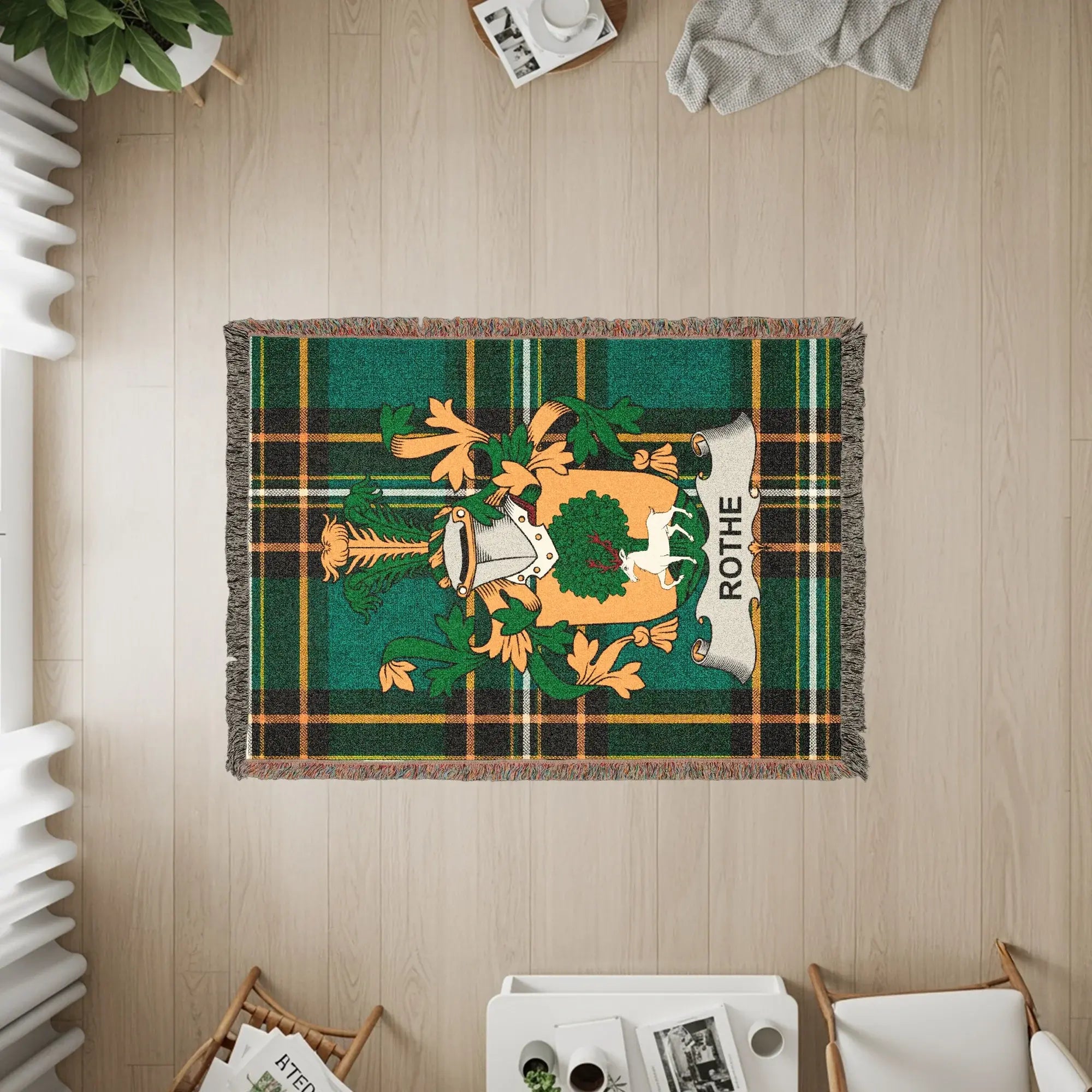 Green tartan throw blanket with Rothes clan crest.