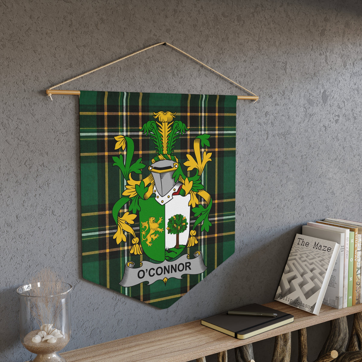 O'Connor family crest displayed on a green plaid banner against a textured wall.