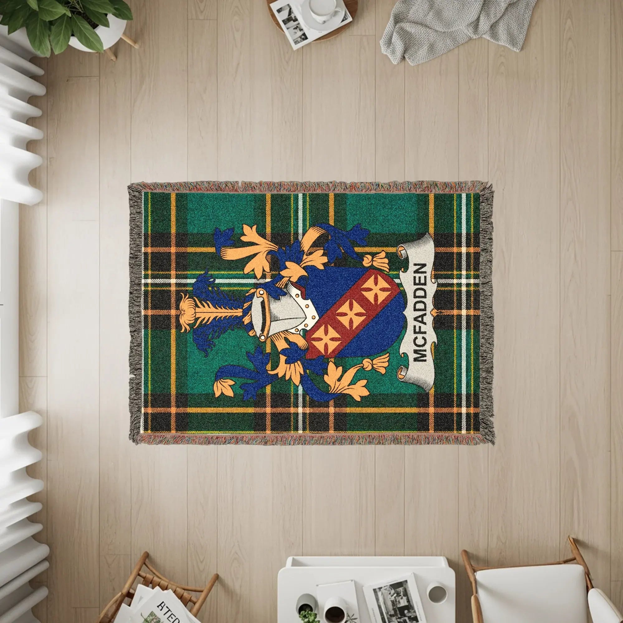 Tapestry with a blue and gold crest and "MCFADDEN" on a tartan plaid background.