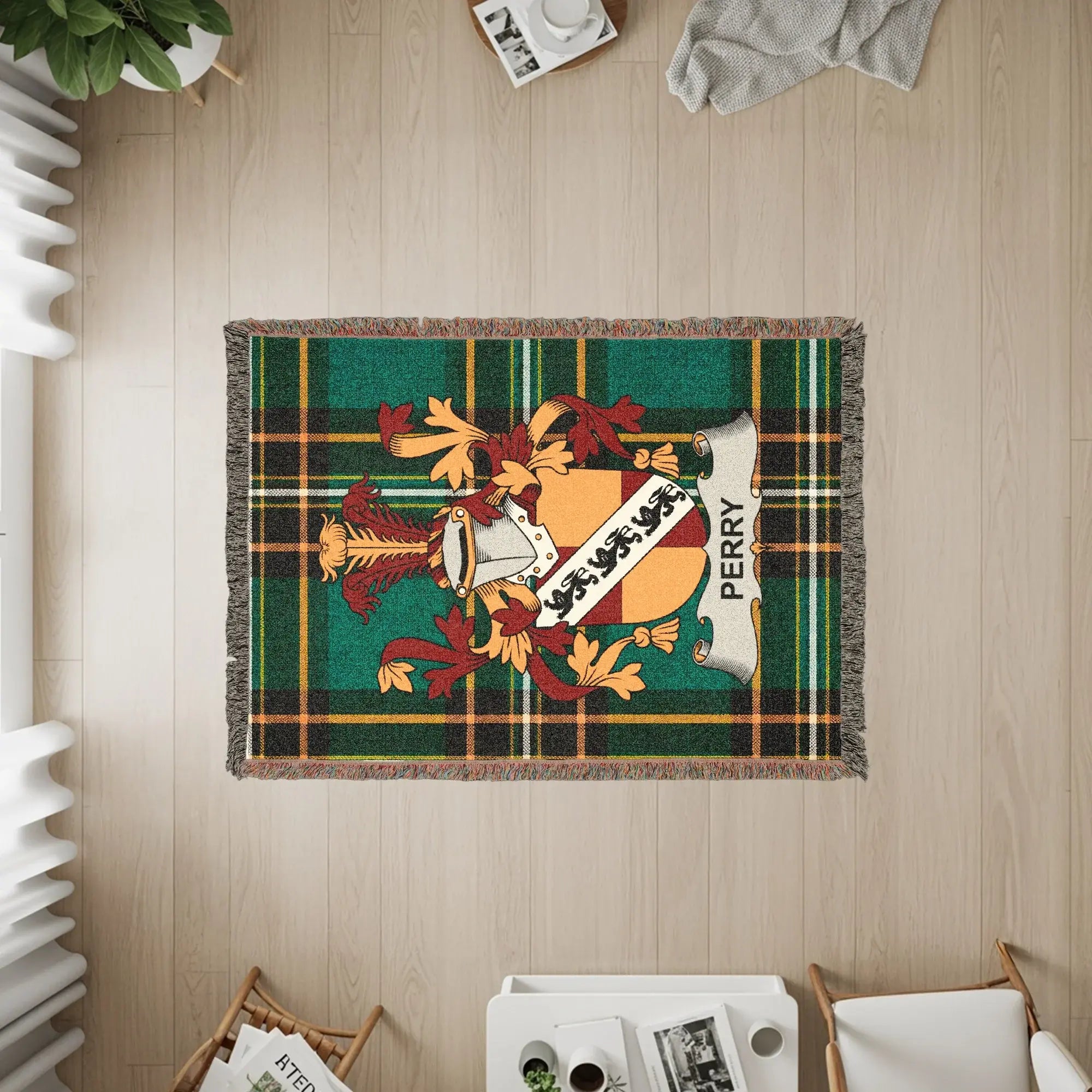Perry family crest on a green plaid woven throw blanket.