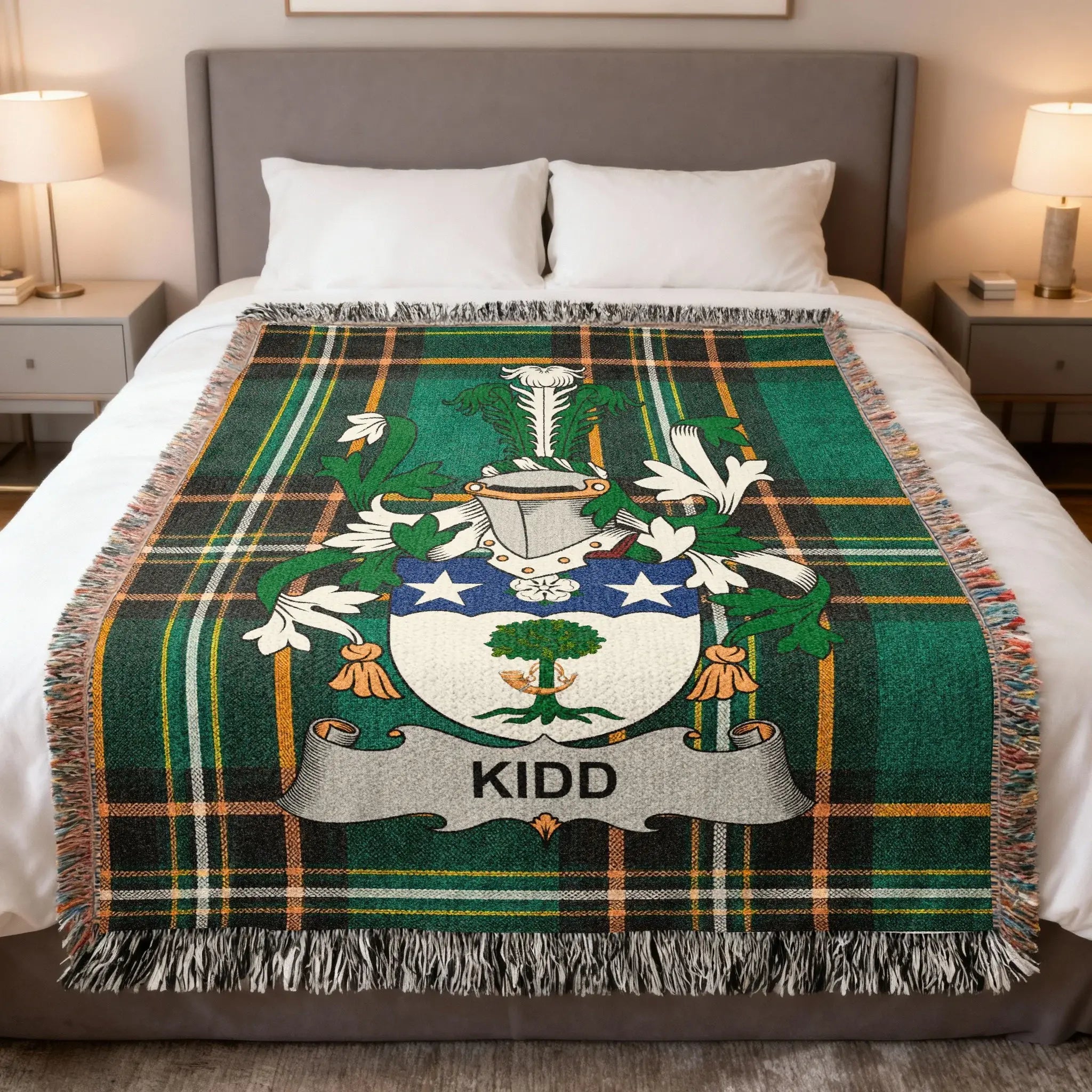 Kidd family crest on a green tartan blanket draped across a bed.