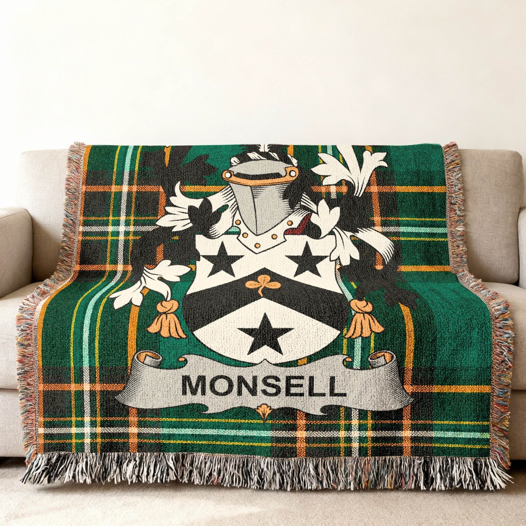 Green plaid blanket with the MONSELL family crest displayed prominently.