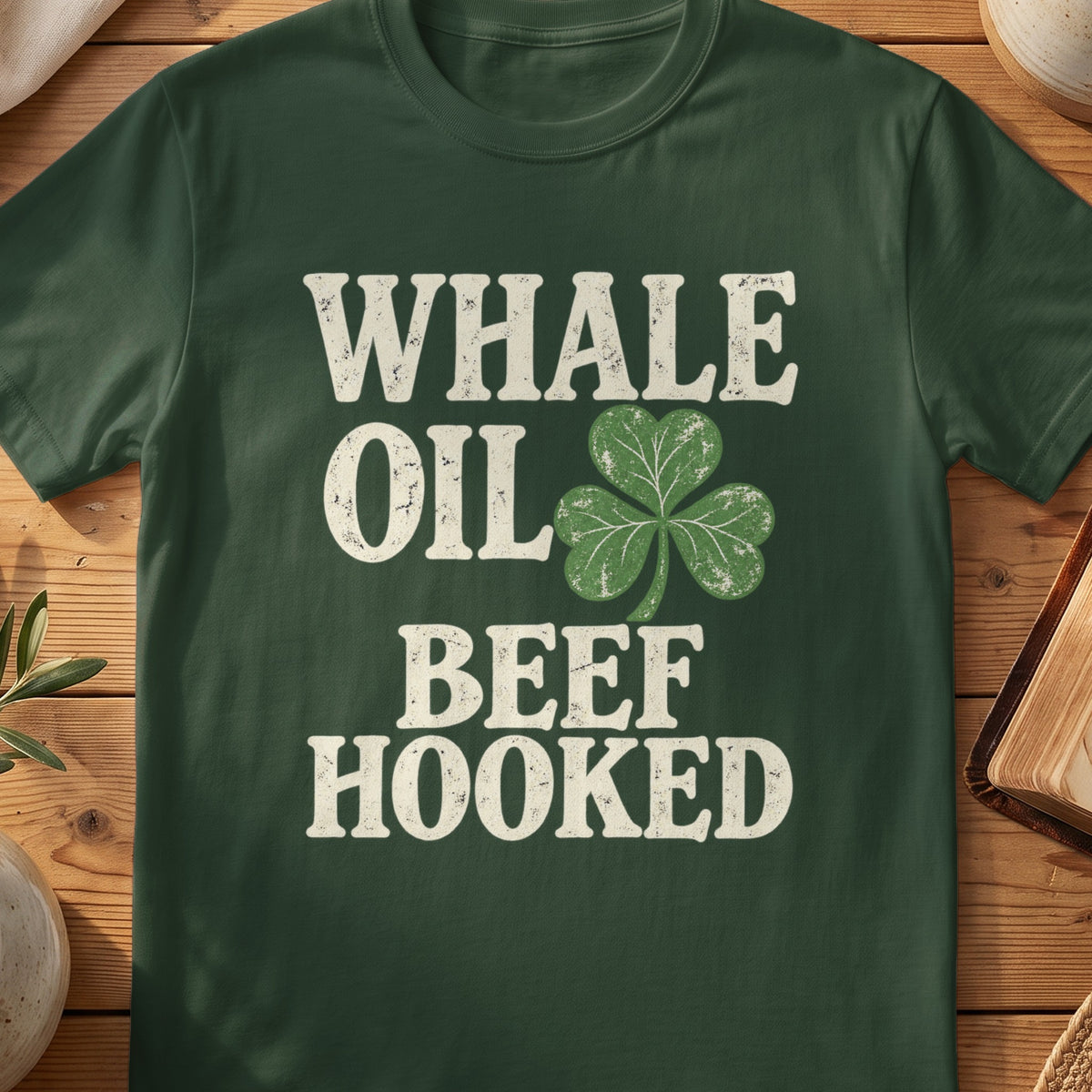 Dark green T-shirt with “Whale Oil Beef Hooked” text and shamrock graphic.