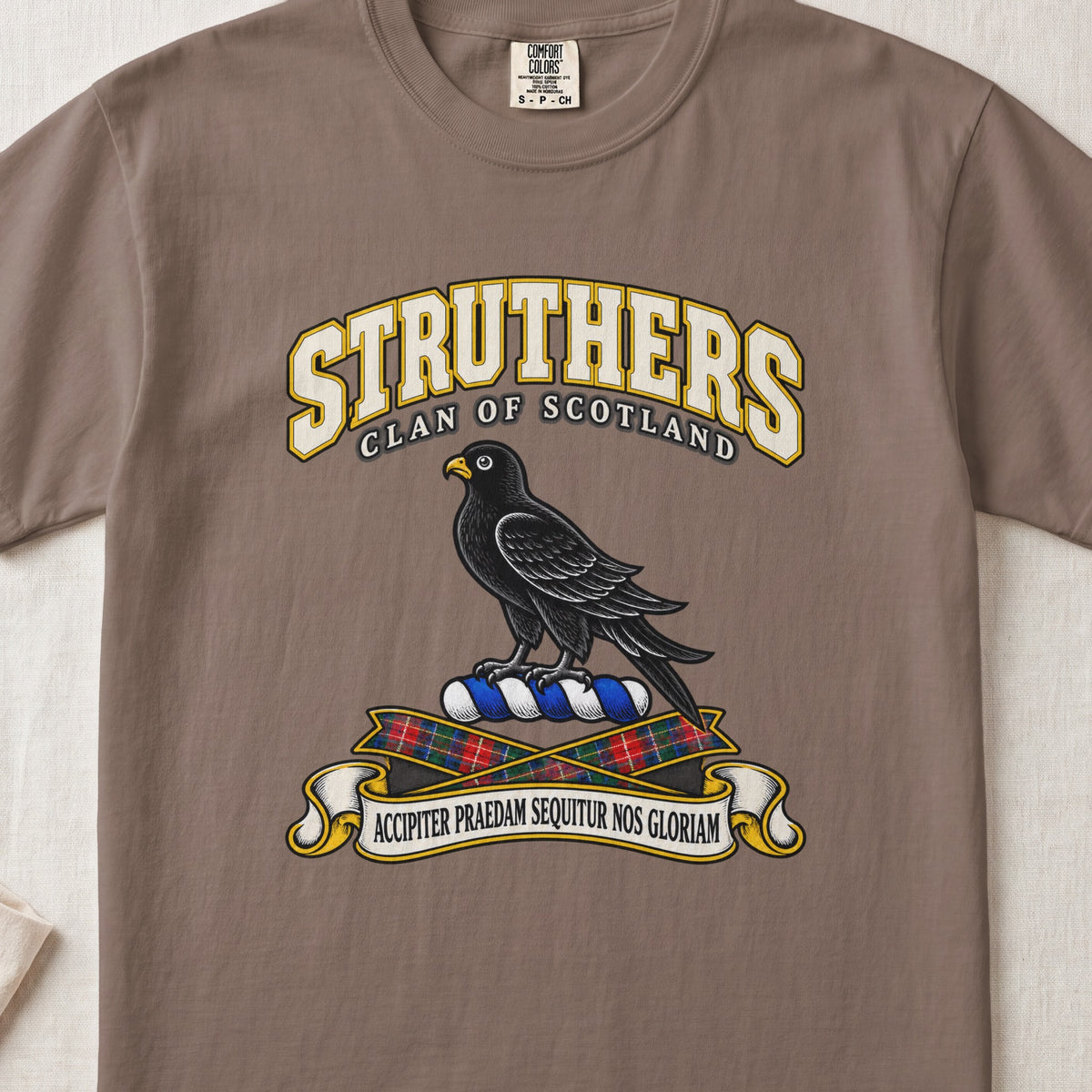 Struthers Scottish clan T-shirt in Espresso, front view with a black bird with a golden beak and motto design.