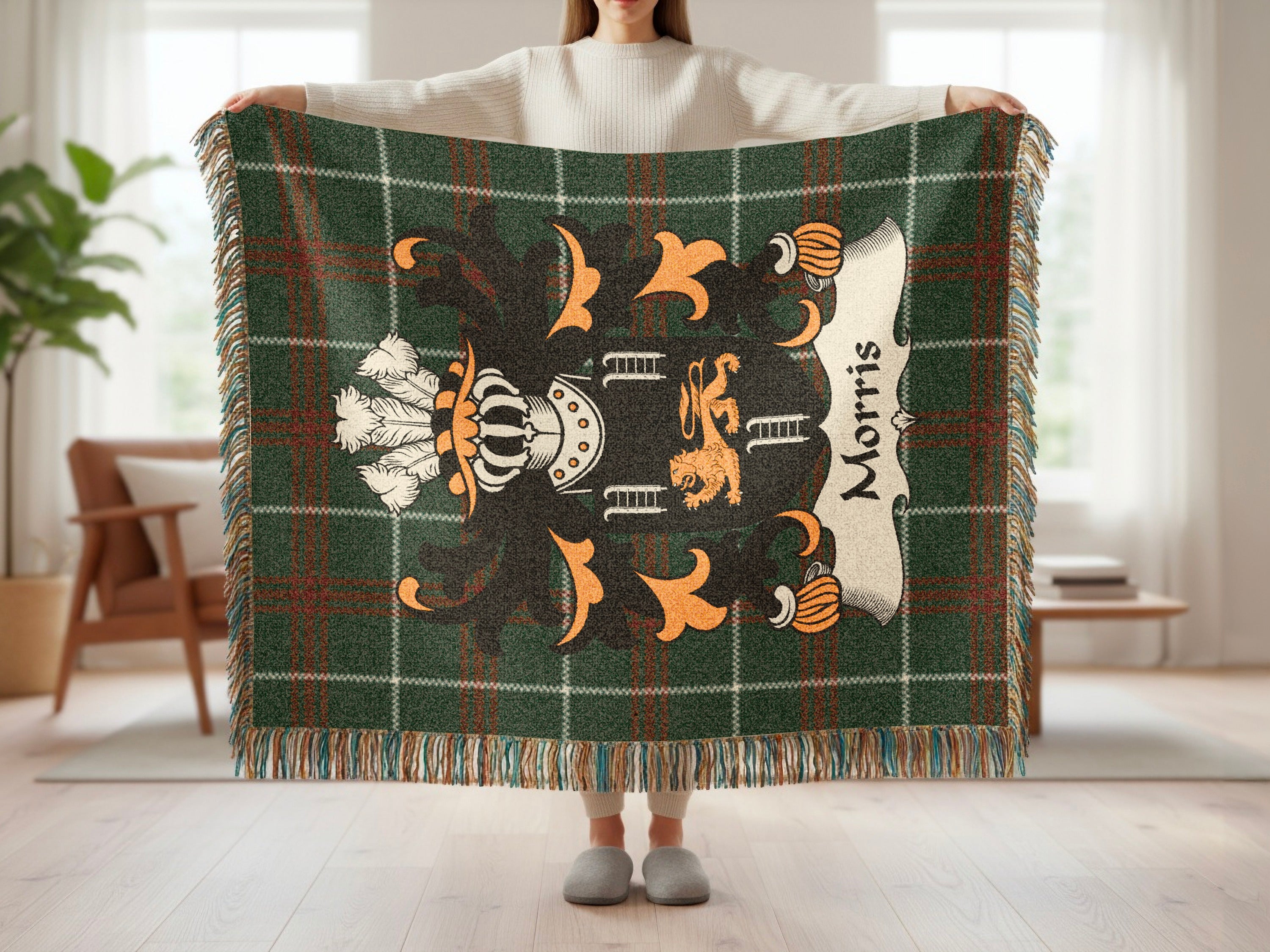 Green plaid blanket with Morris family crest and fringe.