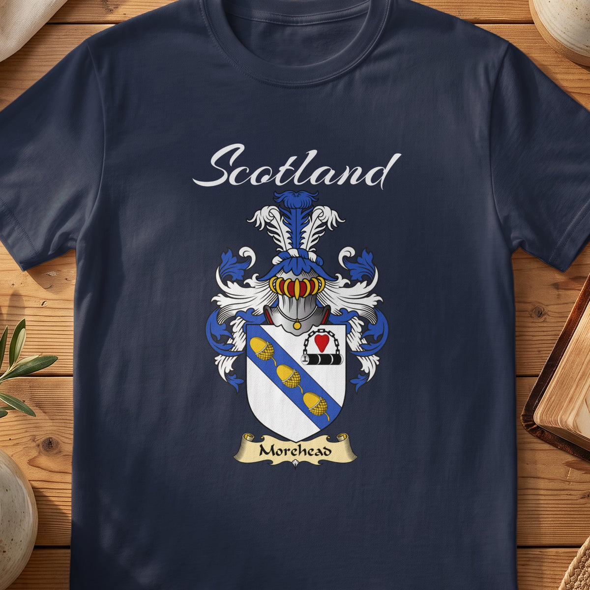 Navy Morehead family shield T-shirt featuring a blue diagonal band with gold motifs