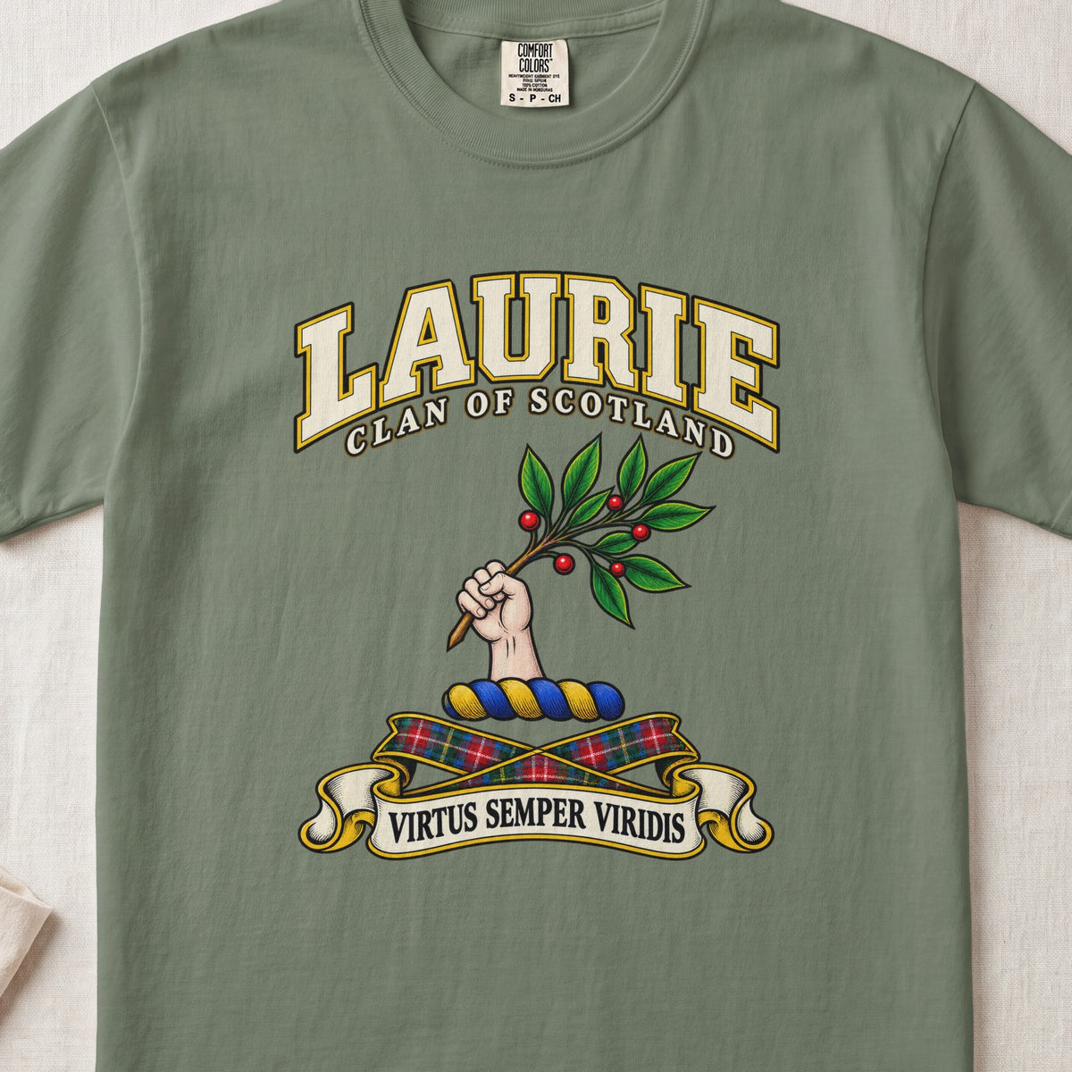 Laurie Scottish clan T-shirt in Moss, front view with a hand holding a leafy branch with red berries and motto design.