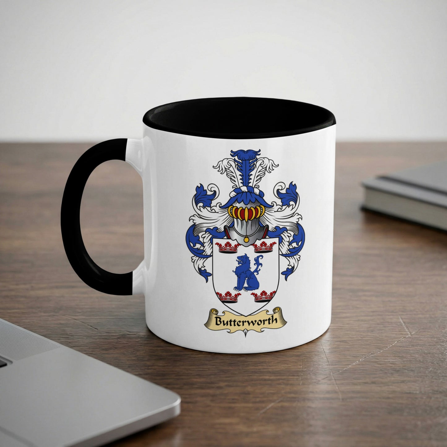 Mug with black rim and handle, featuring a coat of arms with "Butterworth" below.