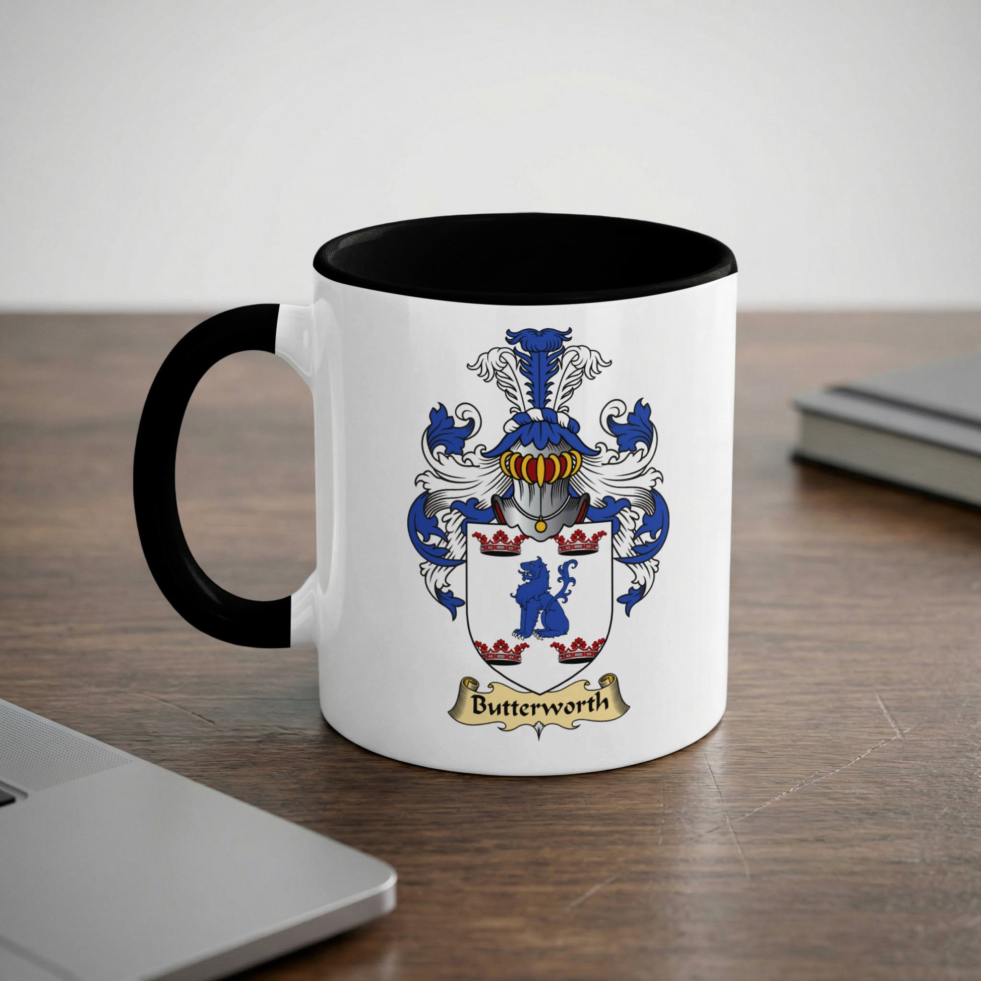 Mug with black rim and handle, featuring a coat of arms with "Butterworth" below.