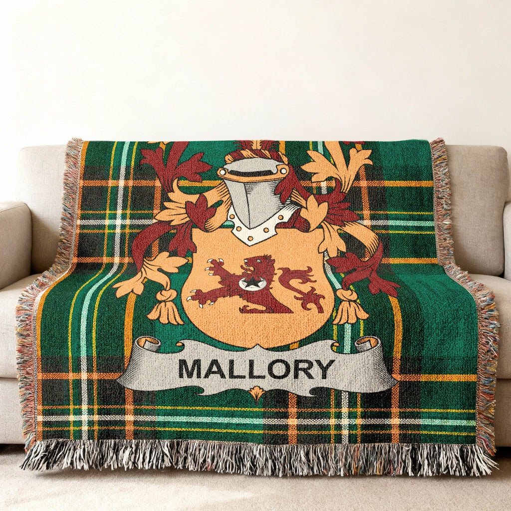 Mallory family crest woven into a green plaid throw blanket.