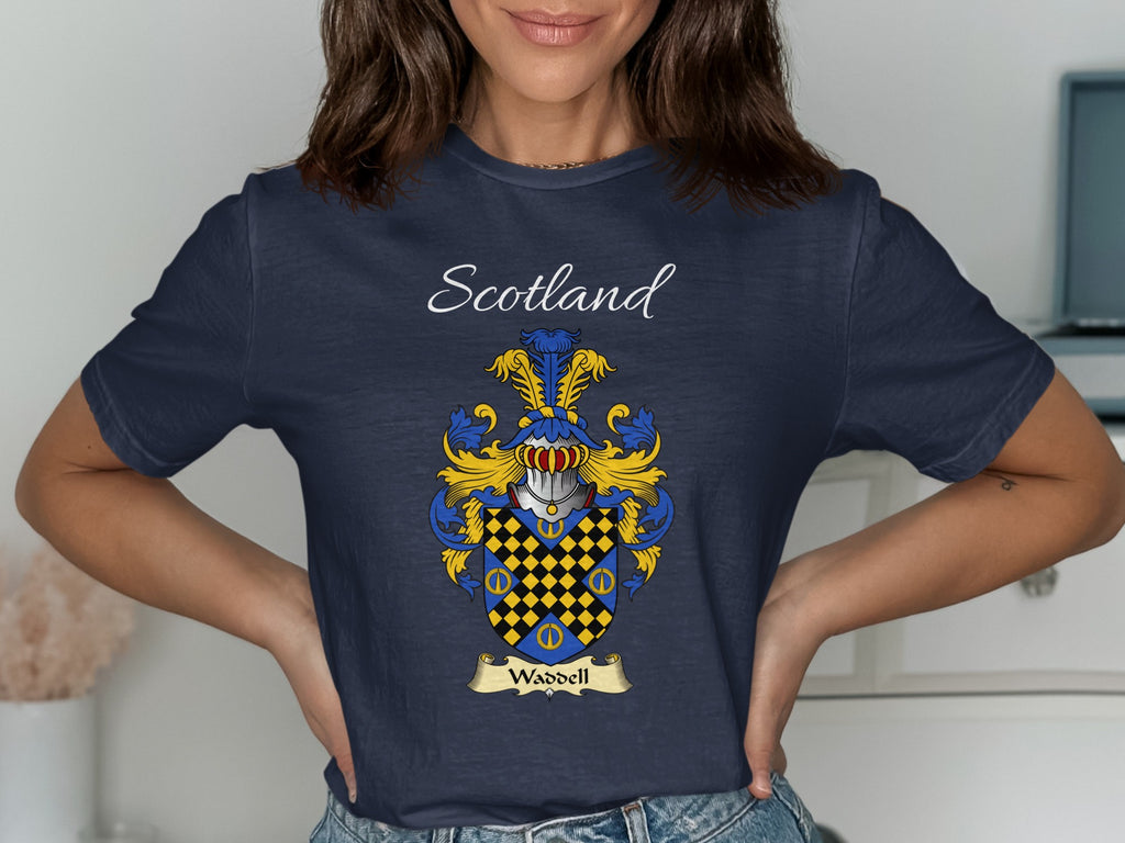 Model wearing the navy Waddell family crest T-shirt featuring “Scotland” and the surname banner.