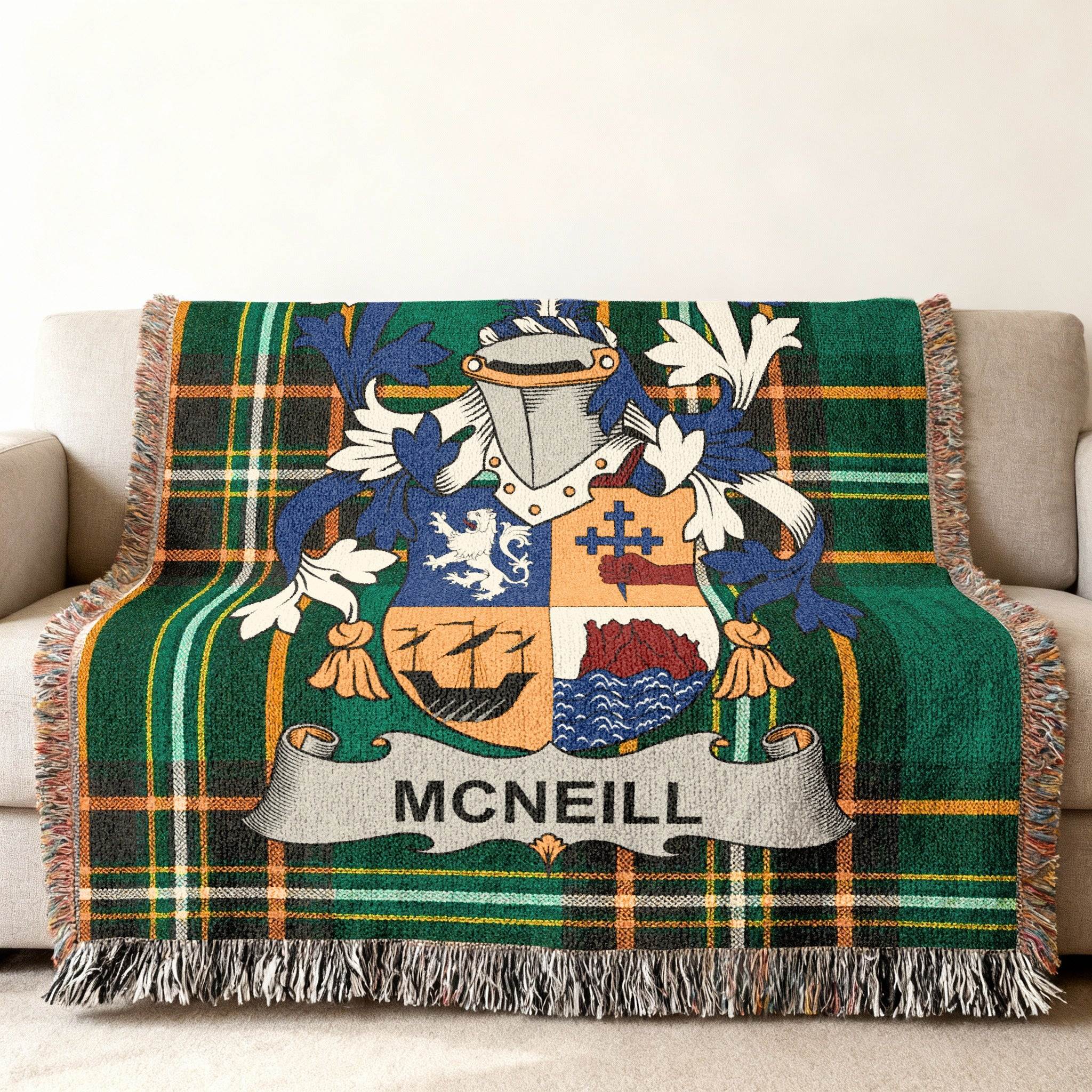 McNeill family crest on a green tartan plaid throw blanket.
